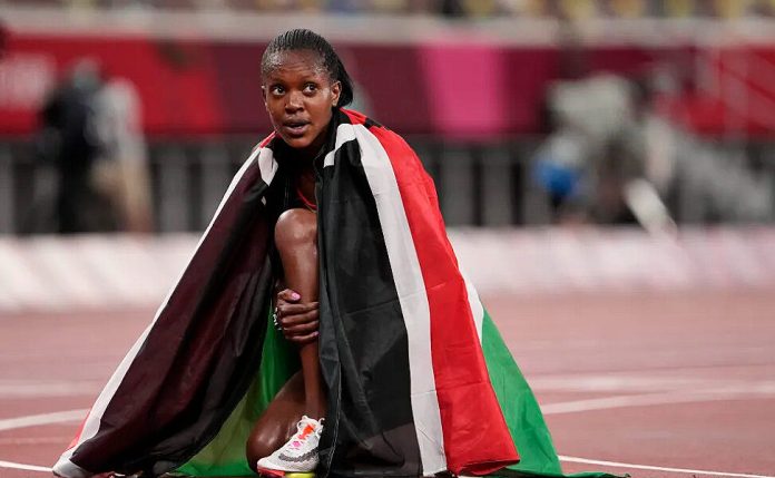Faith Kipyegon of Kenya celebrates after winning the 1,500m final at the Tokyo Olympics.PHOTO/AP