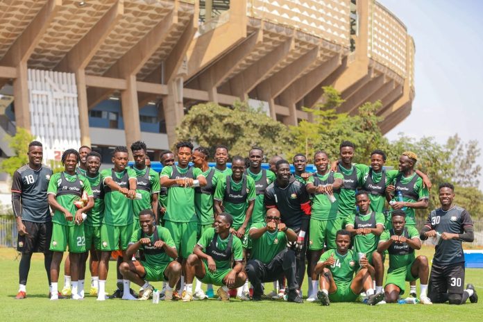 Harambee Stars players pose for a photo with musician Bien after a training session ahead of CHAN 2024. Image source: FKF