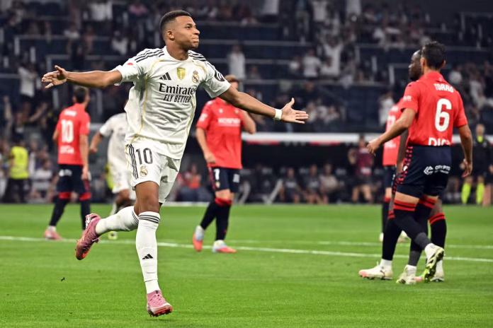 Real Madrid's French forward #10 Kylian Mbappe celebrates scoring the opening goal from the penalty spot Javier SORIANO / AFP