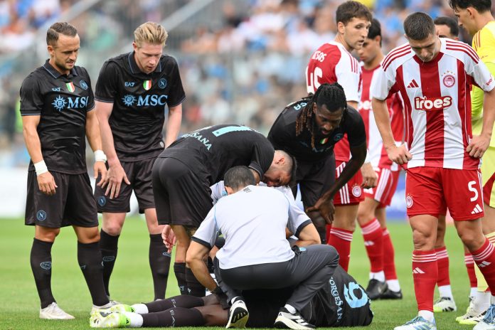 Romelu Lukaku of Napoli lies on the pitch after being injured during the pre-season friendly match between Napoli and Olympiacos at Stadio Teofilo Patini on August 14, 2025 in Castel di Sangro, Italy. (Photo by Giuseppe Bellini/Getty Images)